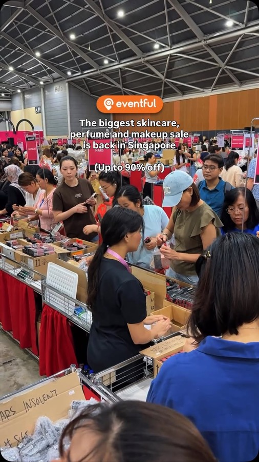 Shoppers crowding around bins of NARS lipsticks at Beauty Fiesta 2025 in Singapore Expo Hall 6A