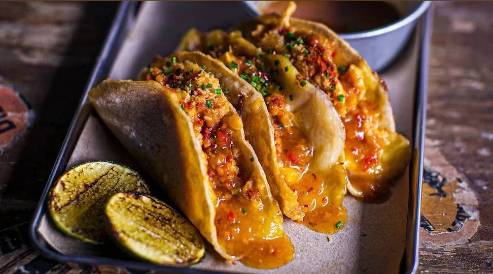 Bushwick Baja fish tacos with jalapeño aioli and grilled lime at Brooklyn Bar