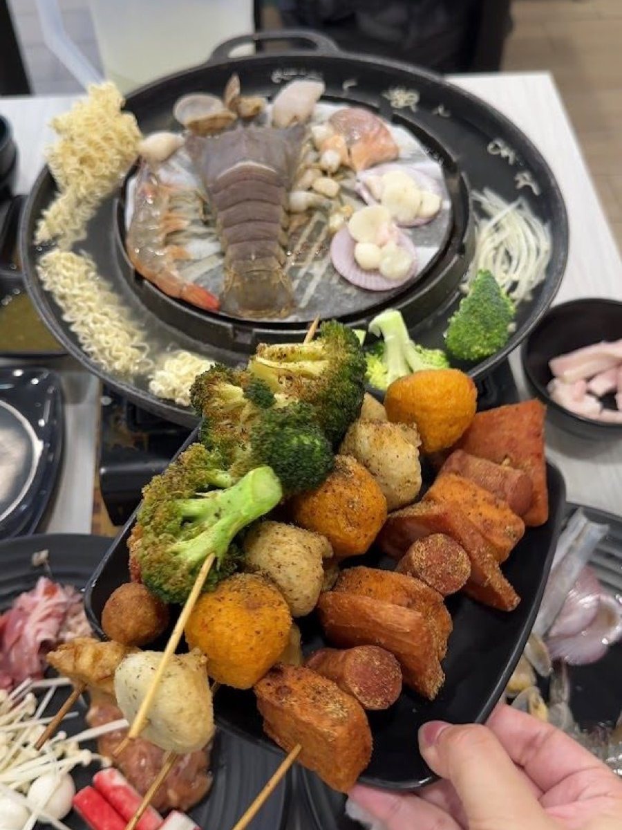 Lok lok skewers and baby lobster on a mookata pan