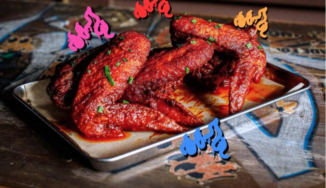NYC Buffalo Wings tossed in red buffalo sauce at Brooklyn Bar