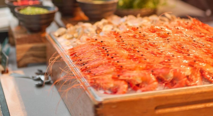 Tray of red prawns on ice at the CLOVE buffet