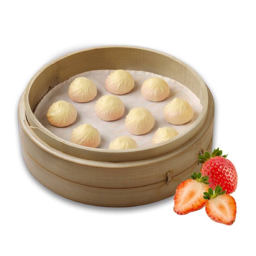 Ten Strawberry Mochi Xiao Long Bao in a bamboo steamer next to fresh strawberries