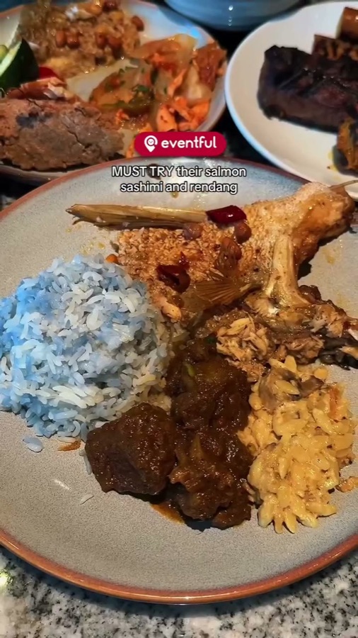 Plate of blue pea rice, beef rendang, orzo and grilled meats from the Ellenborough foie gras buffet
