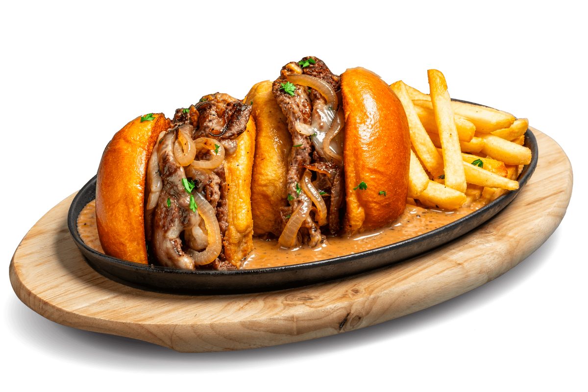 Swensen's Brown Pepper Sizzling Cheese Burger on a sizzling plate with fries