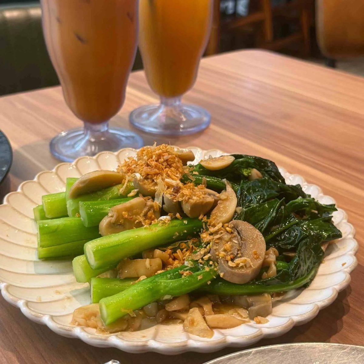 Chinese broccoli with mushrooms and fried garlic at 2GATHER