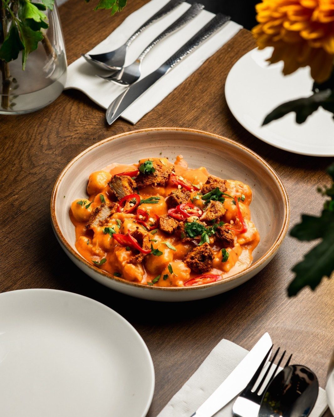 Handmade gnocchi in sauce at Epicurean Fusion
