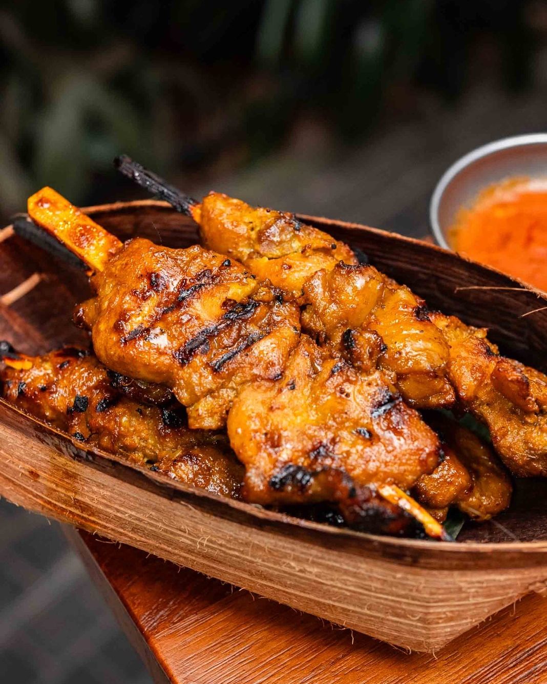 Gula apong chicken satay on a banana leaf boat at KANTIN