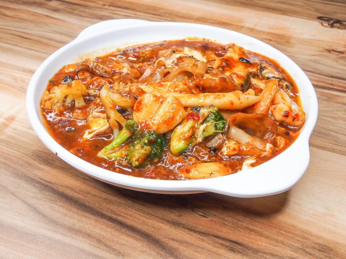 A saucy zi char dish in a white bowl at Uncle Leong Signatures