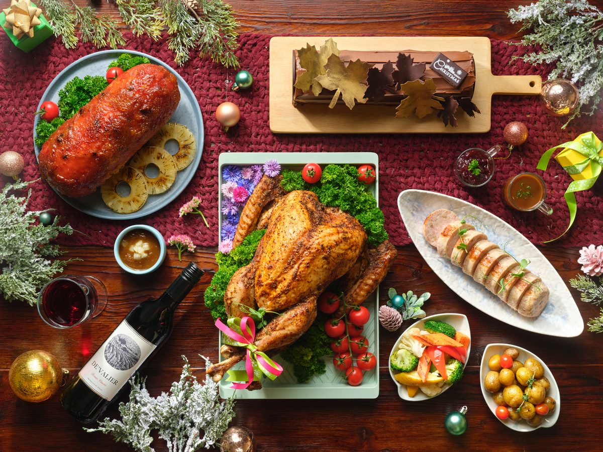 Holiday Inn Atrium Christmas bundle flat lay with turkey, ham, log cake and wine