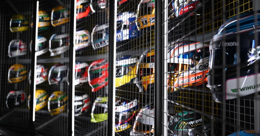 The F1 Exhibition's wall of drivers' helmets, one of the gallery moments inside the show