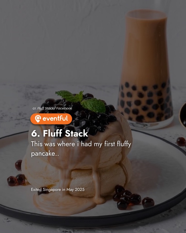 Fluff Stack soufflé pancakes topped with brown sugar pearls, beside a glass of milk tea