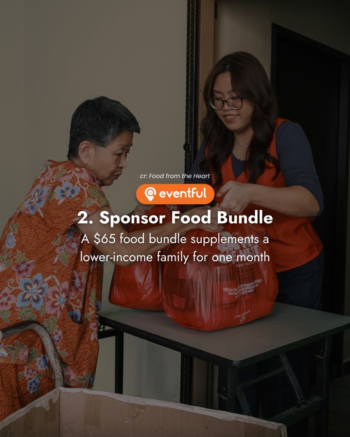 A Food from the Heart volunteer hands a bag of groceries to an elderly beneficiary