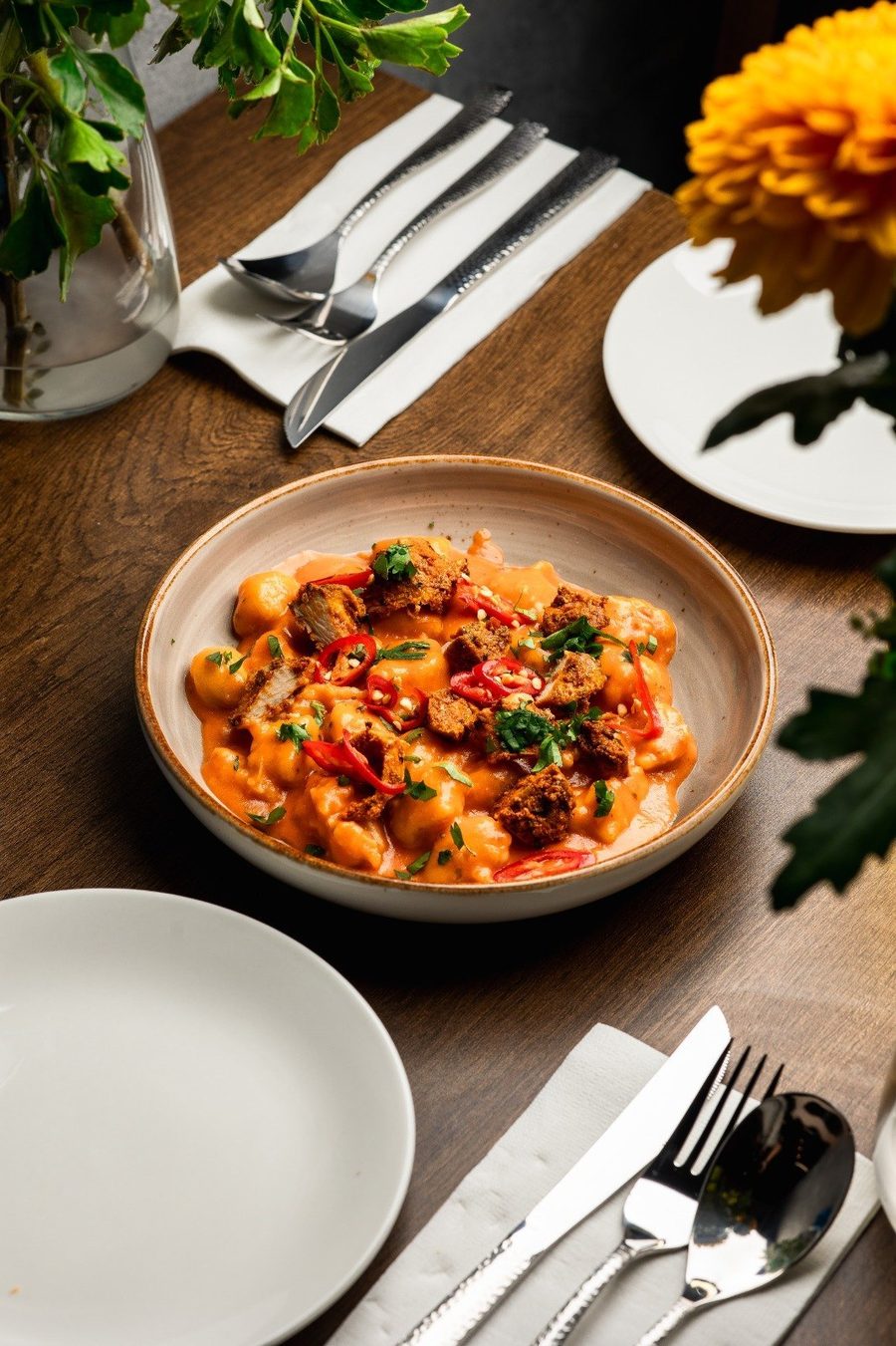 Handmade gnocchi in a red sauce at Epicurean Fusion