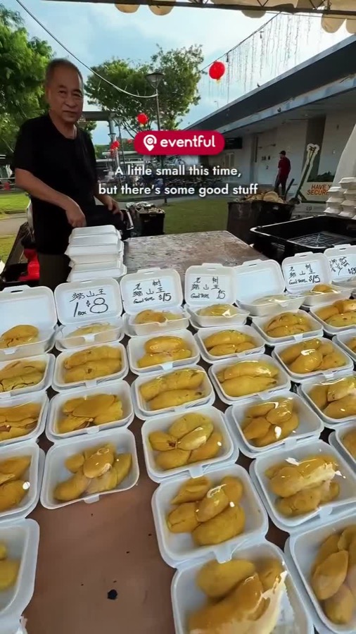 Boxes of Musang King durian priced $8 and old tree Musang King at $15 at the Hougang pasar malam