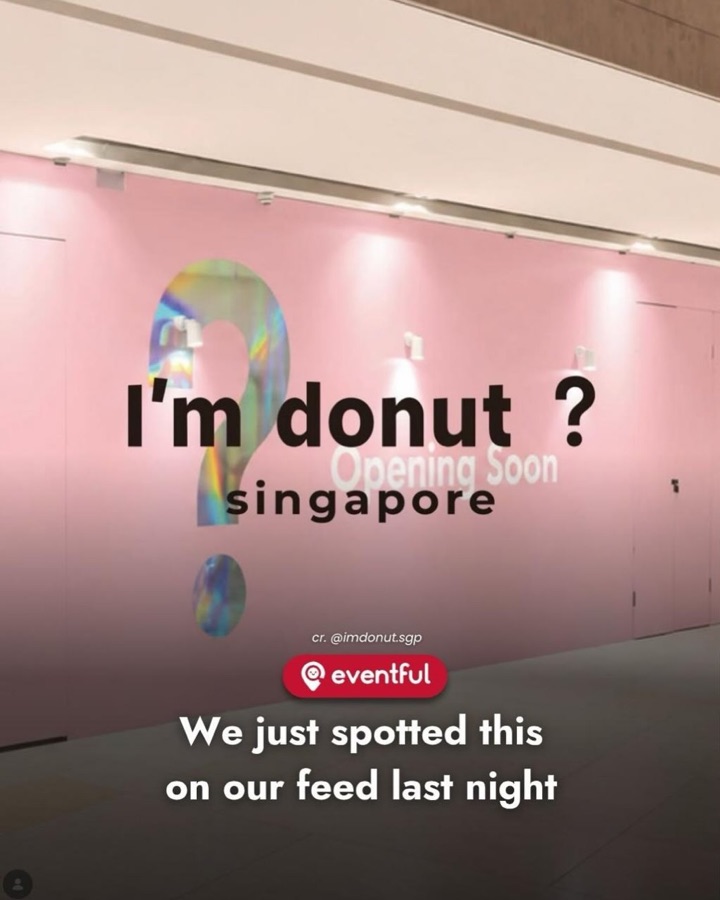 I'm donut? Singapore Opening Soon hoarding in pink with a holographic question mark
