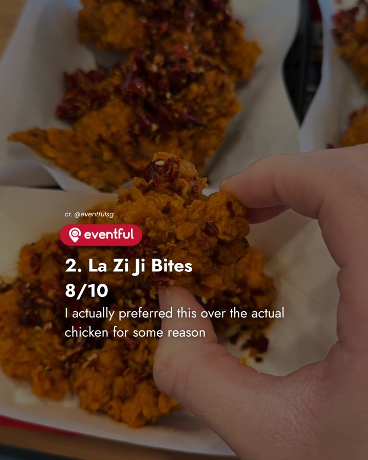 A La Zi Ji Bite held up over a tray of KFC Sichuan mala chicken