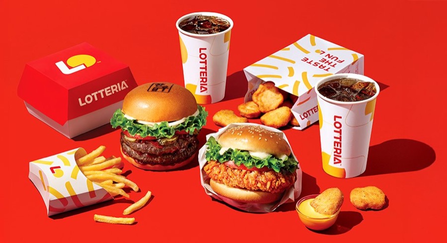 Lotteria burgers, fried chicken, fries and drinks in Lotteria packaging on a red background