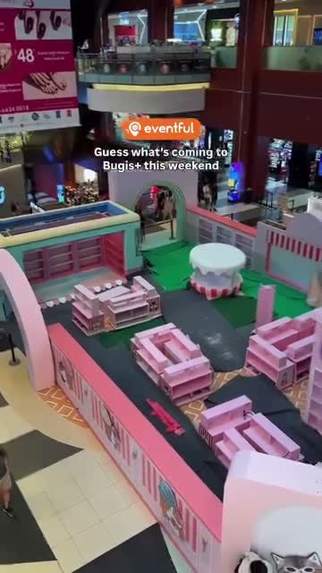 The MINISO x mofusand pop-up set under construction at the Bugis+ Level 2 Atrium, seen from the level above