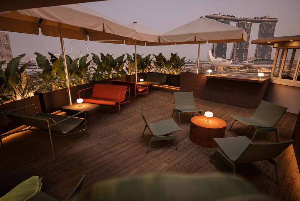 The SOHAUS rooftop deck at Moutai House with Marina Bay Sands at dusk