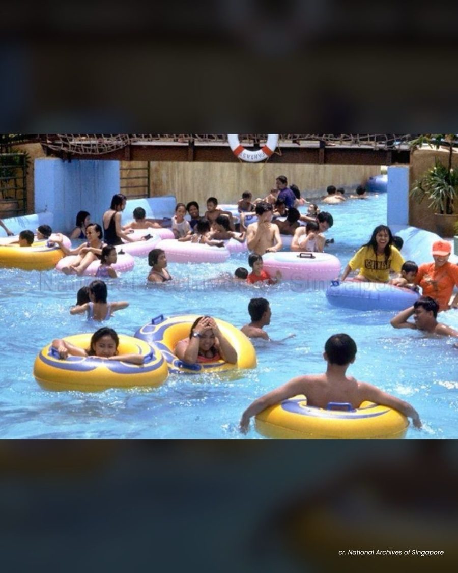 Families on yellow inflatable rings in the Fantasy Island wave pool at Sentosa in the 1990s