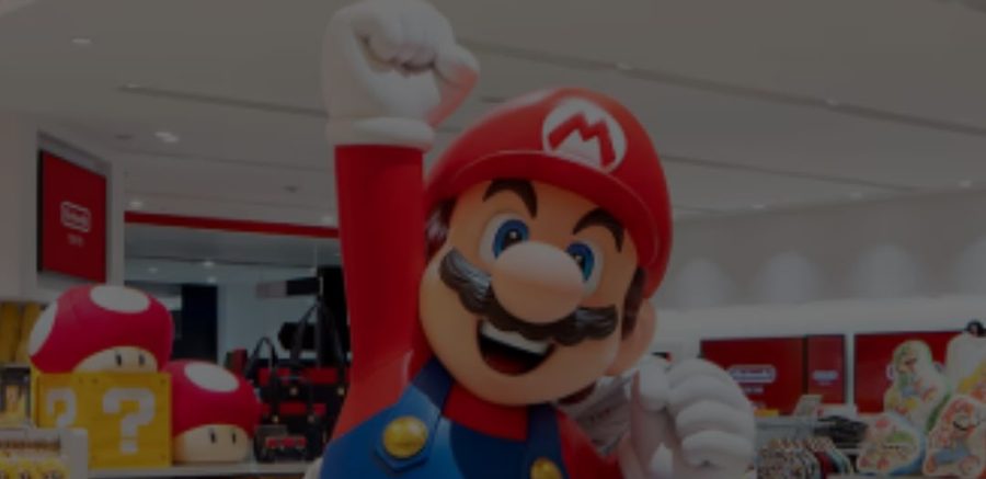 Inside a Nintendo pop-up store, with a Mario figure and character merchandise