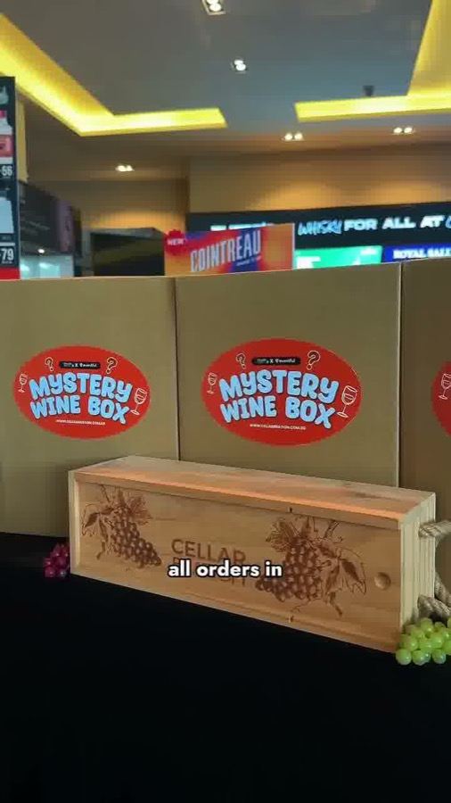 Two Mystery Wine Box packs on display at a Cellarbration store
