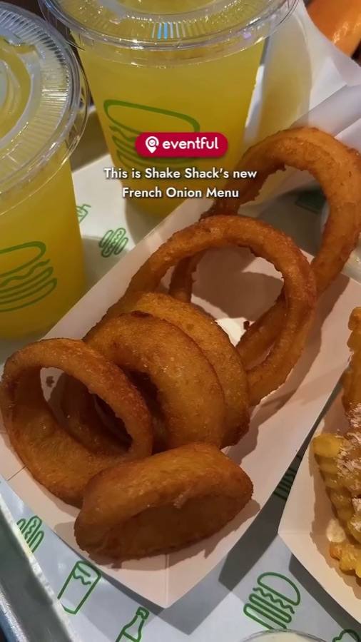 Onion rings, crinkle fries, lemonade and French Onion burgers on a Shake Shack tray