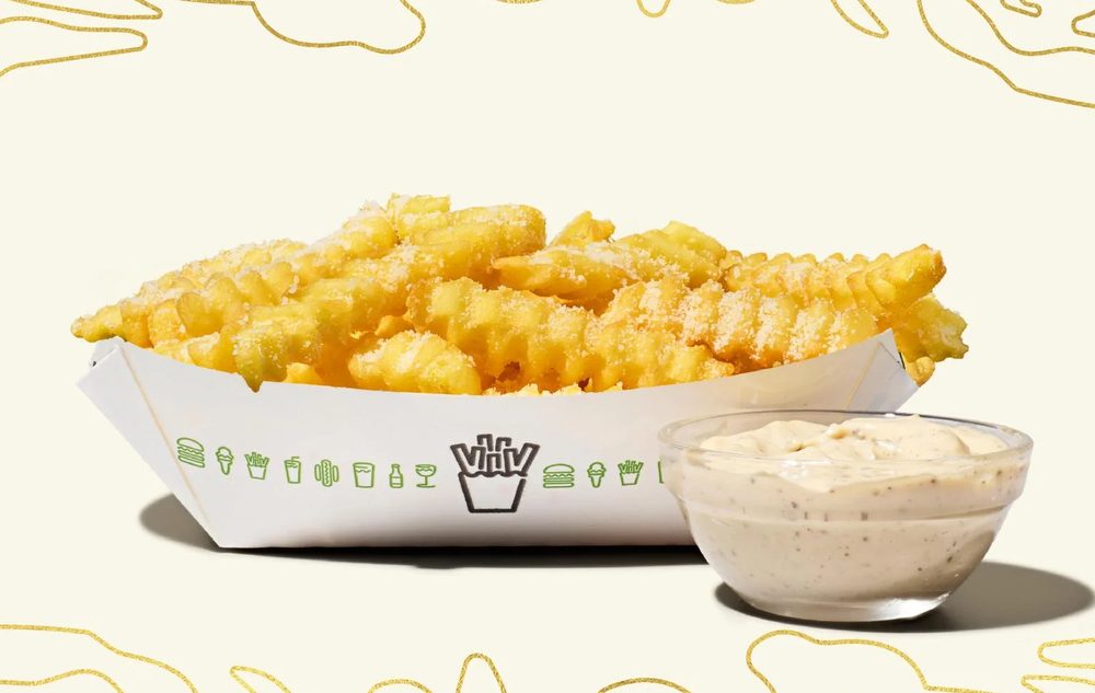 Shake Shack White Truffle Fries with parmesan and a pot of truffle sauce