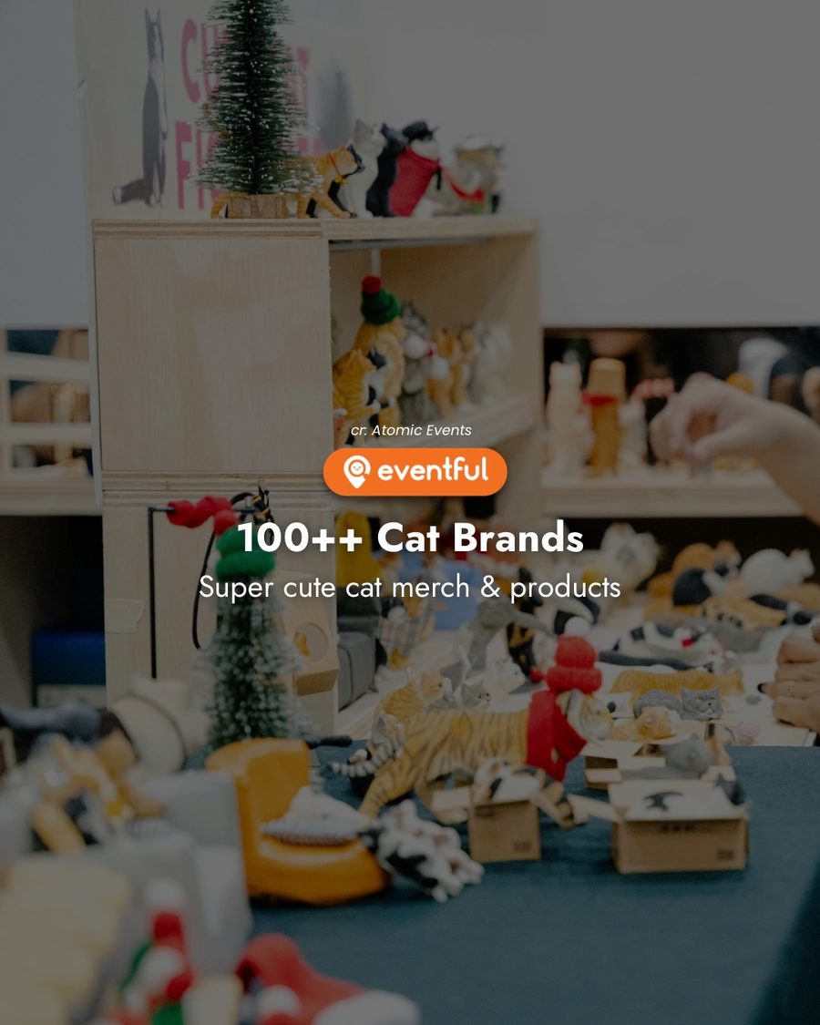 Cat merch stall with figurines and a small Christmas tree at a past Singapore Cat Festival
