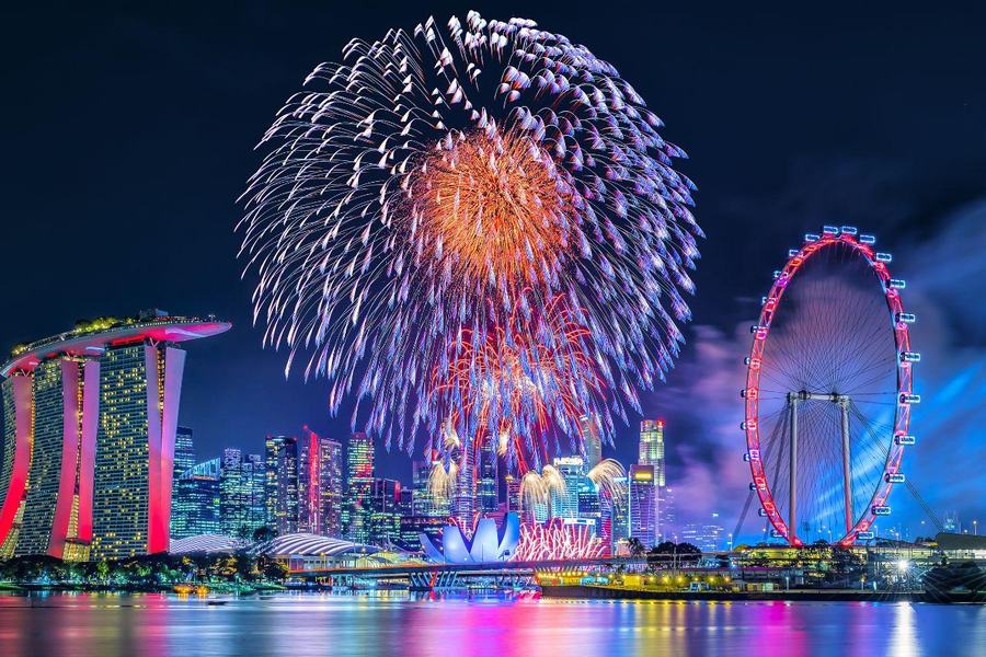 Fireworks over Marina Bay with the Singapore Flyer lit up on the right