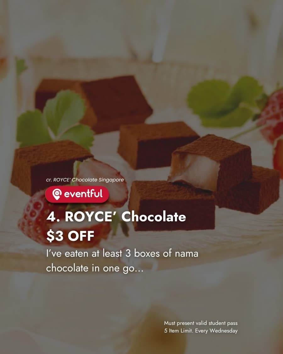 Cubes of ROYCE nama chocolate dusted in cocoa powder beside fresh strawberries