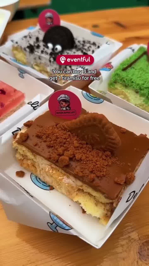 A slice of Sugar Mama Lah biscoff tiramisu topped with a whole biscoff biscuit and crumbs