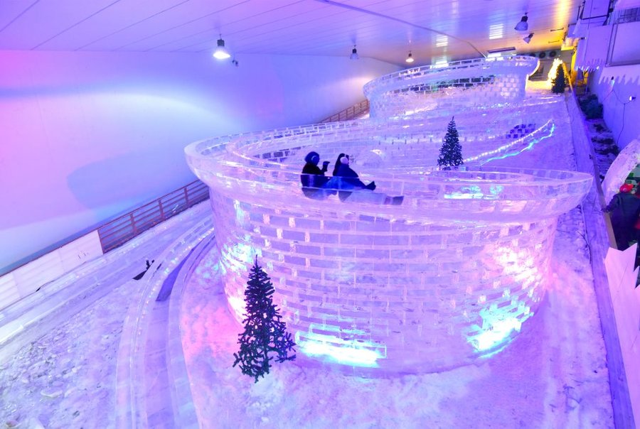 The snow slope and ice sculptures inside Snow City Singapore