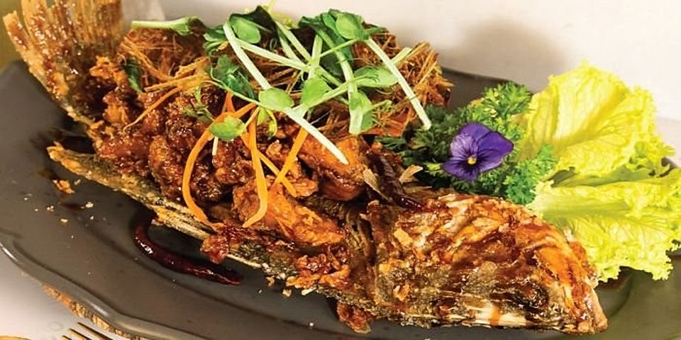Crispy tamarind fish topped with fried lemongrass at 2GATHER
