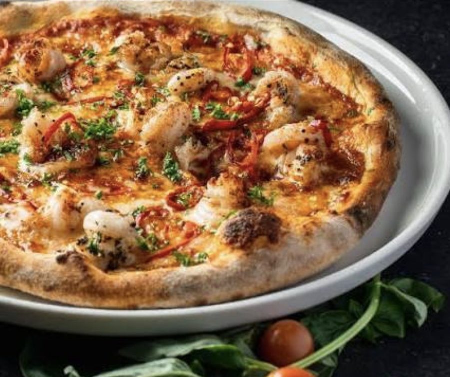 Prawn pizza on a charcoal base at Epicurean Fusion