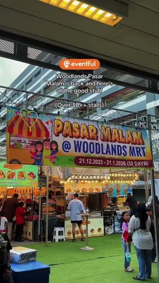 Pasar Malam at Woodlands MRT entrance banner showing 21.12.2025 to 21.1.2026, 32 days