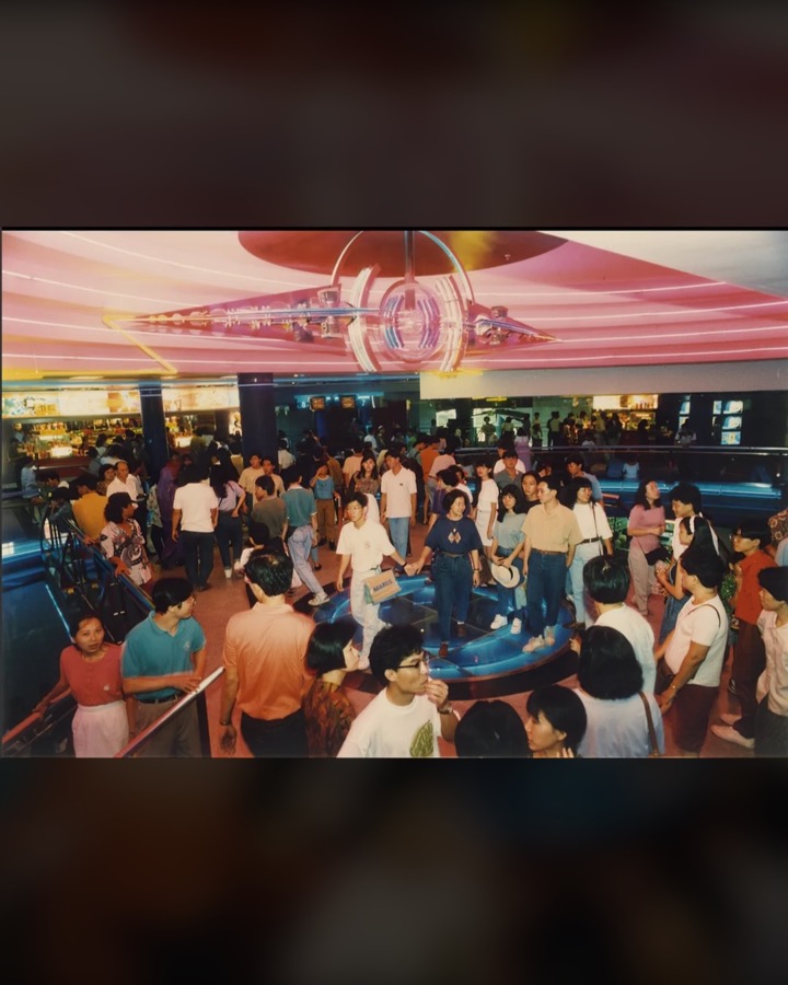 Crowd in the neon lobby of Yishun 10 cinema in the 1990s