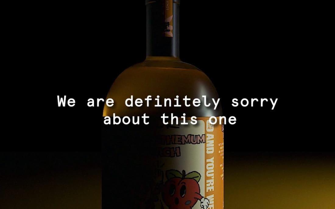 A Sorry For: bottle lit low in the dark, captioned we are definitely sorry about this one