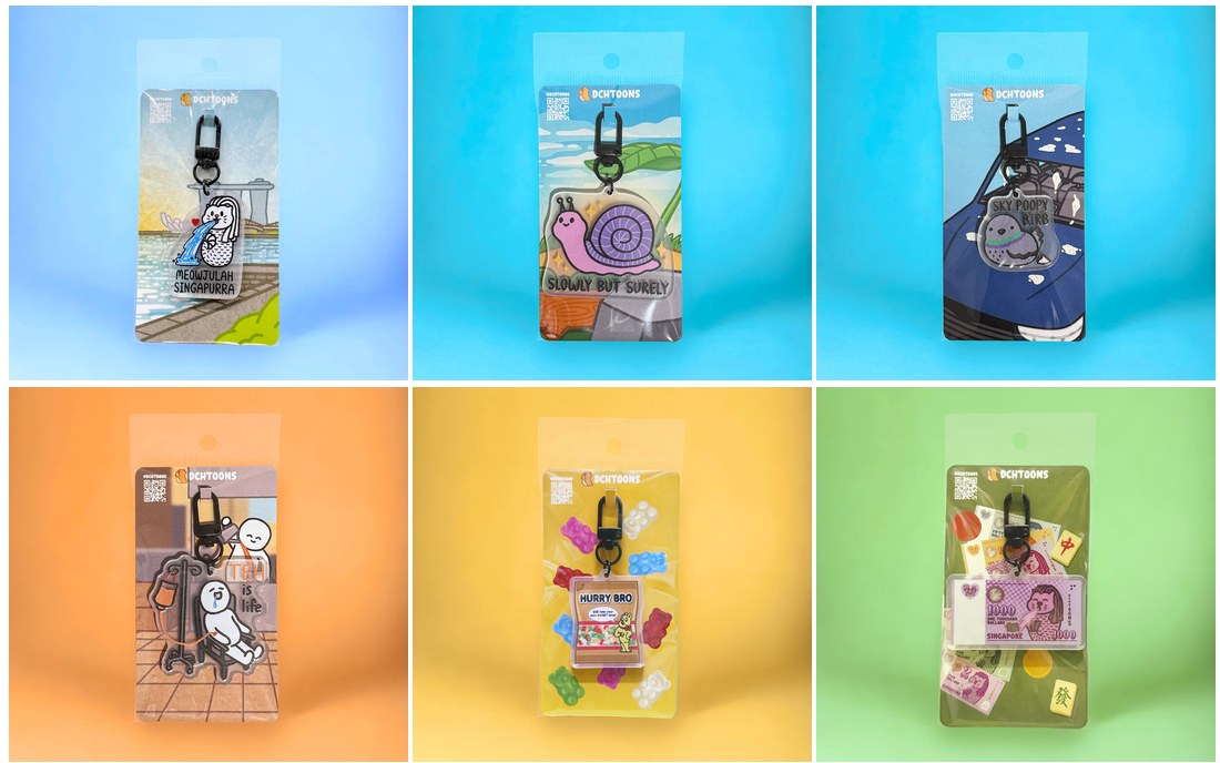 Six DCHTOONS keychains in their packaging: Meowjulah Singapurra, Slowly But Surely, Sky Poopy Birb, Hurry Bro and more